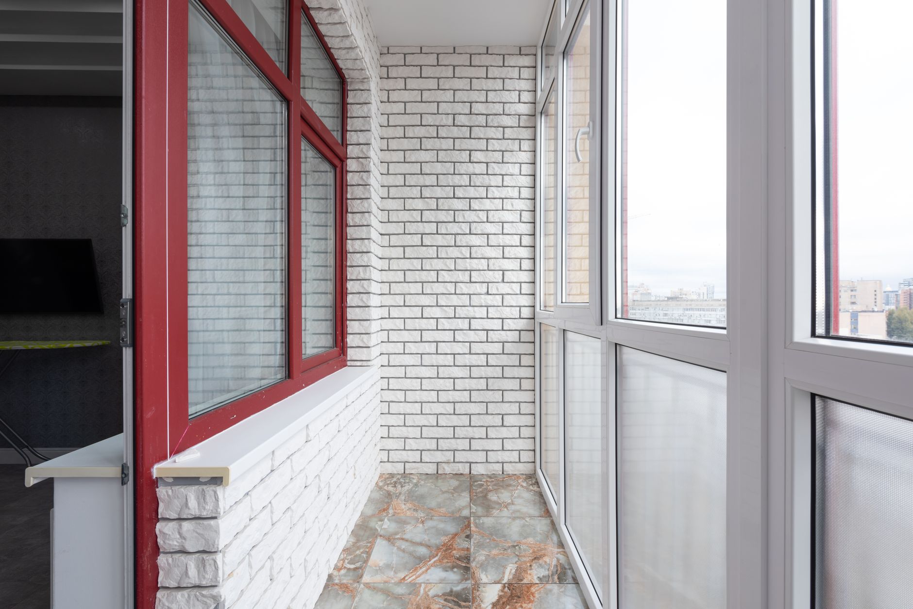Bright room with a marble floor and wide panoramic windows